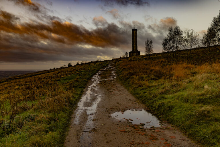 A very long cold walk over Holcombe Hill.  Up over the hill and through Buckden woods.  Looking over to Scout Moor as the sun rises and lights up the hills and valleys from behind the morning clouds.