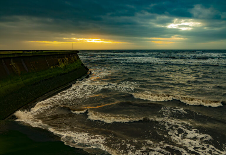 Switching on time for Blackpool Illuminations as the sun sets over a blustery sea.  The combination of colours makes some eye catching pictures.