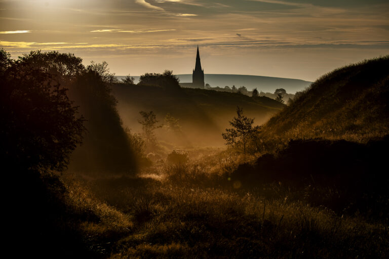 A bright and cold spring morning in Belmont.   The dew is slowly burnt away as the sunlight spreads across the hills.