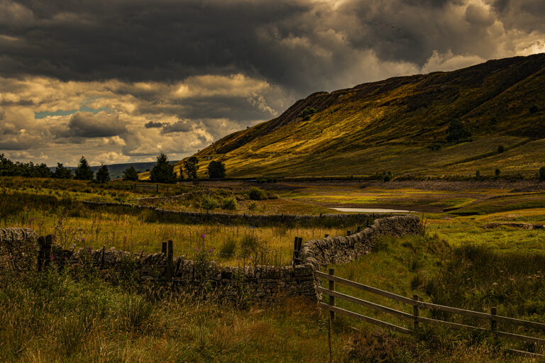 Calf Hey Reservoir looking extremely empty.  I was able to get down to the water line which is probably  twenty feet lower than normal.   The very changeable weather helped create some dramatic images with one minute sun and the next cloud and always the threat of rain.  Sometimes bad weather can make the best pictures.
